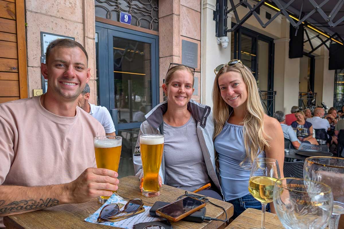 Daniel Bailey and friend drink beer in Cannes France