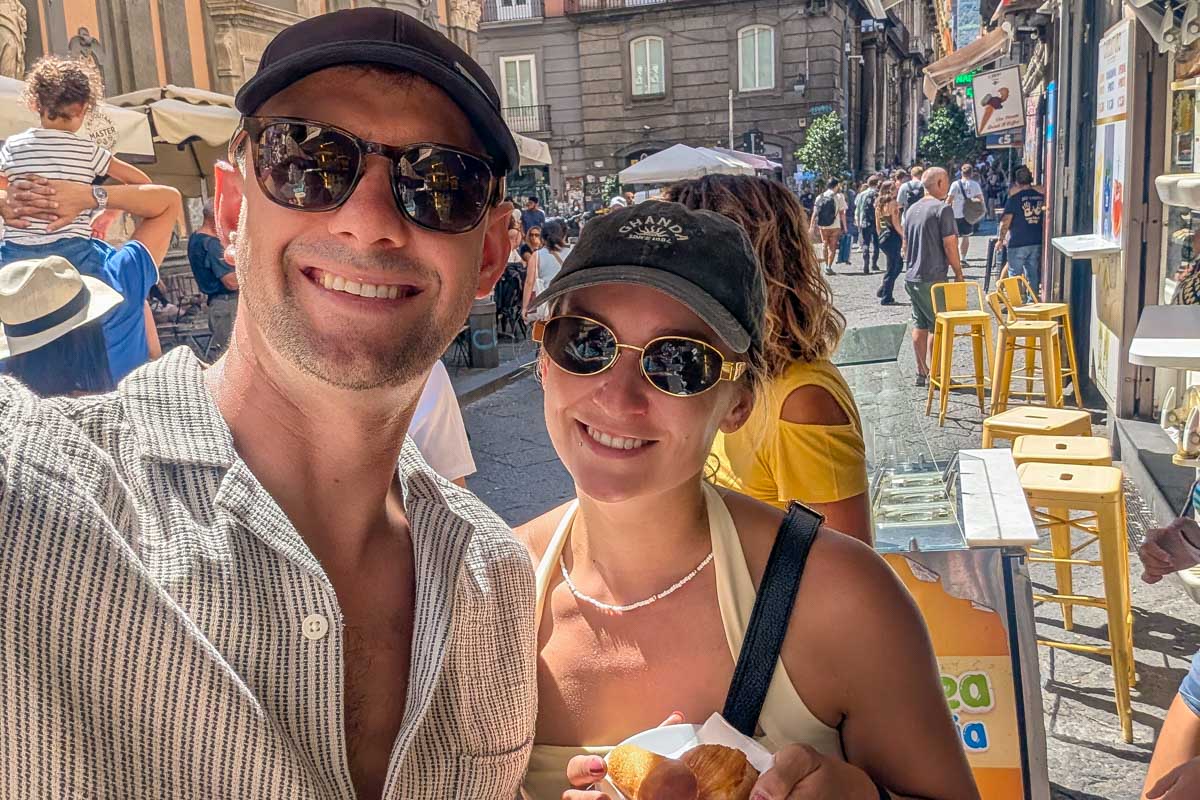 Daniel and Bailey smile and take a selfie on a food tour of Naples Italy