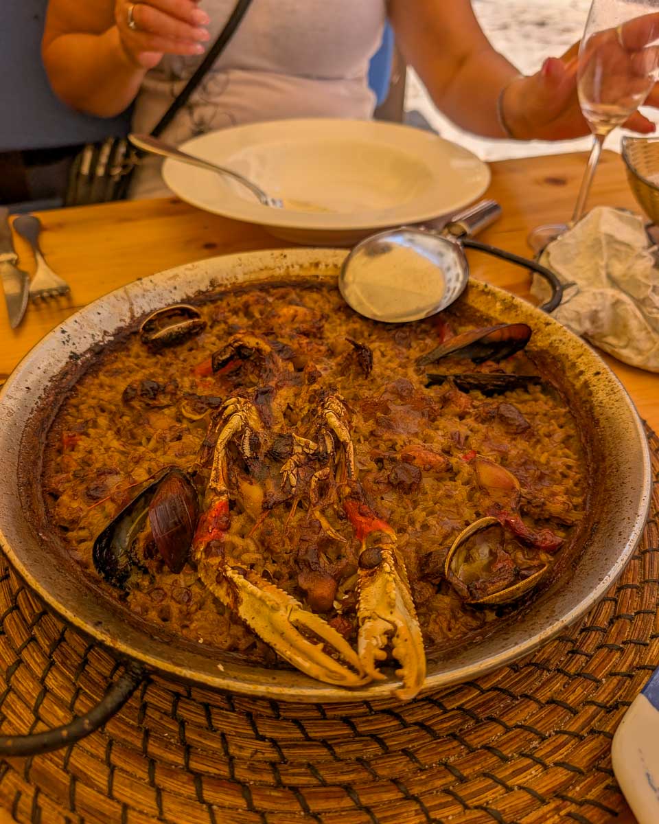 Seafood paella eaten in Vila Vella (Old Town) of Tossa de Mar, a town on the Costa Brava in Catalonia, Spain