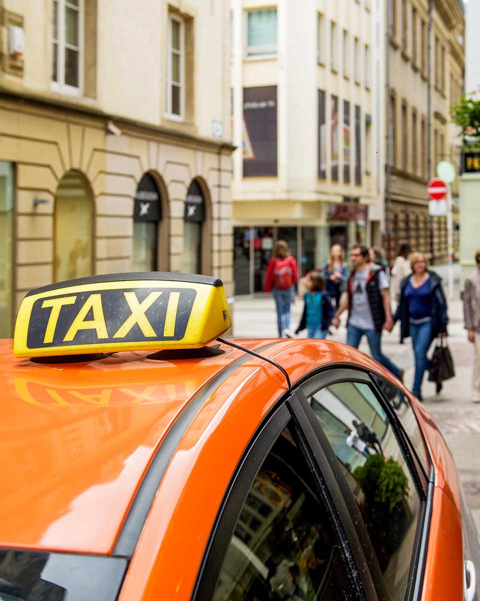 An orange taxi in Europe