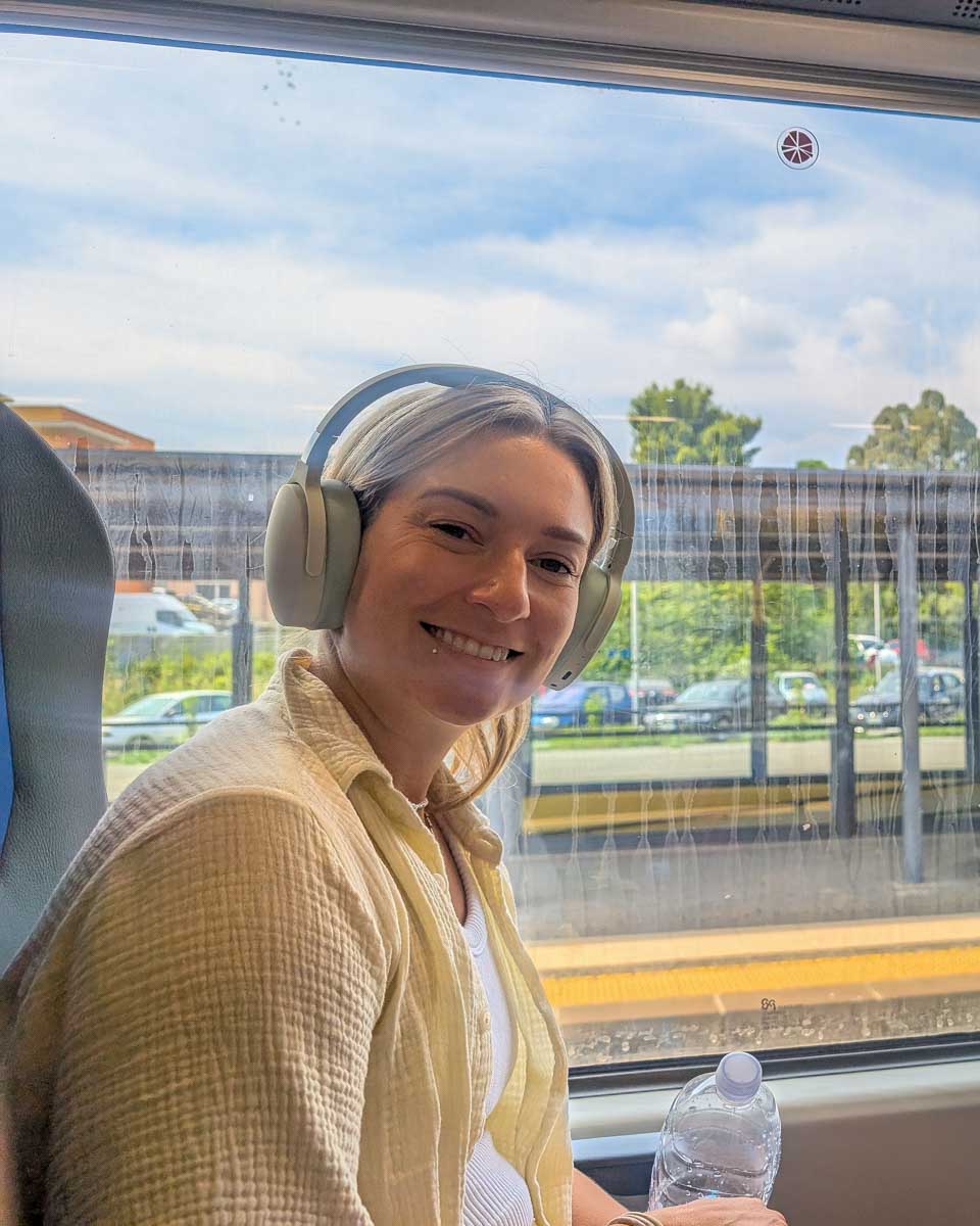 Bailey inside the train smiling in Europe