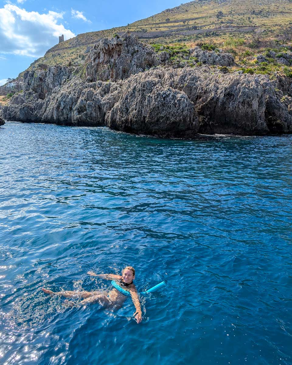 Bailey-in-the-water-on-a-boat-excursion-in-Taormina-Italy