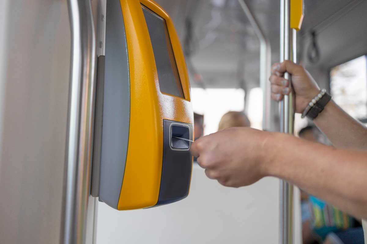 Traveler validating train ticket at terminal in Europe