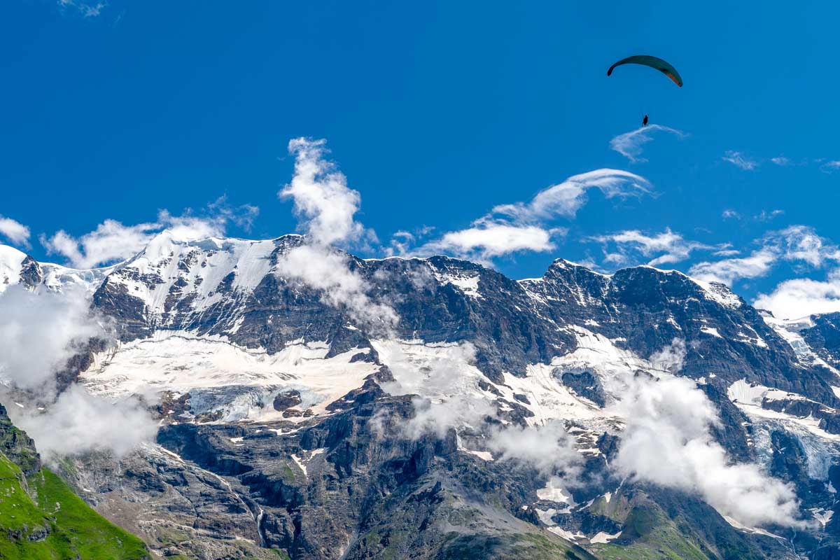 A person Paraglides in Lauterbrunnen Switzerland