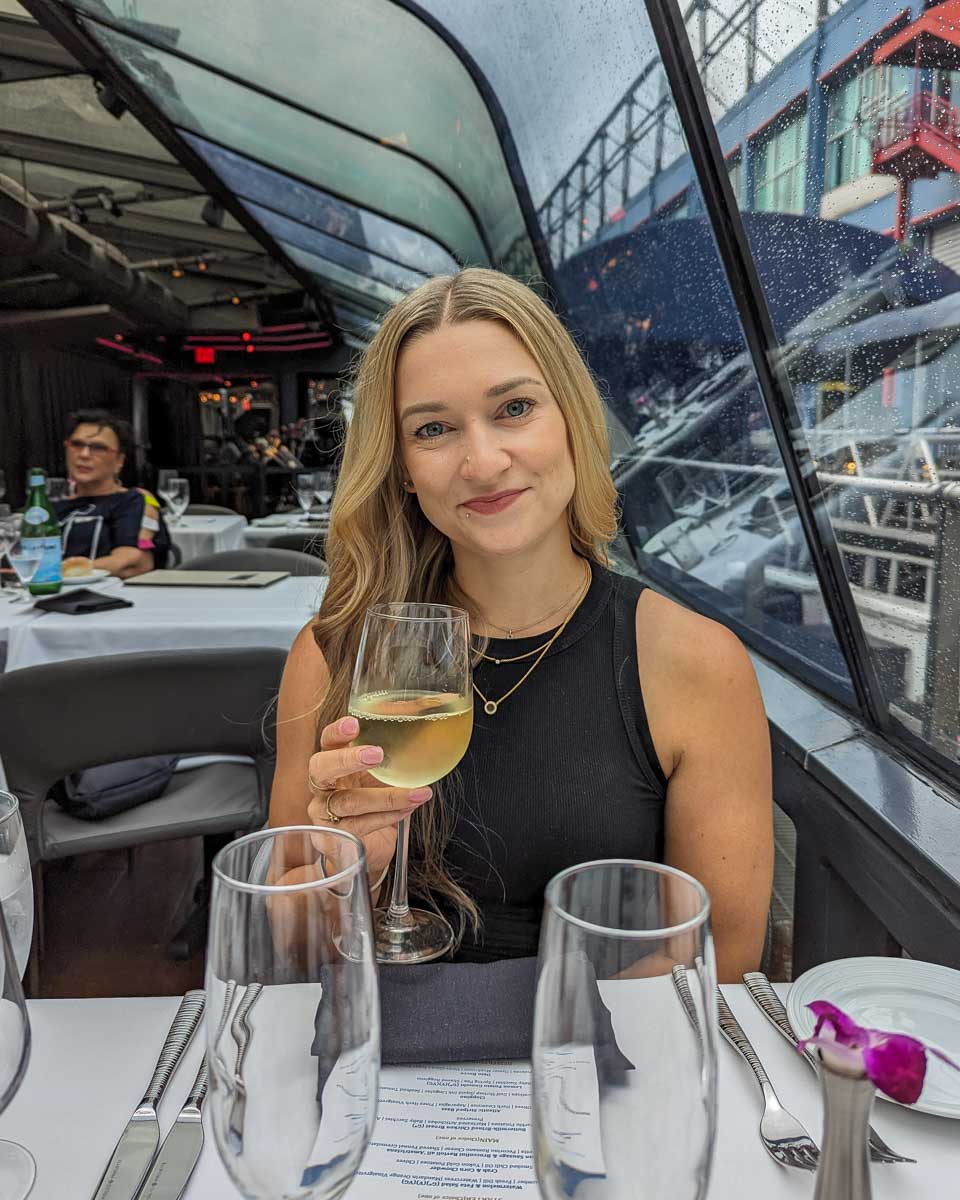 Bailey-with-a-glass-of-wine-on-a-Seine-River-cruise-in-Paris-France