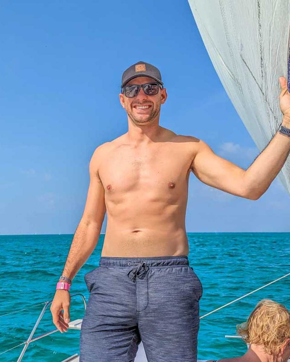 Daniel-poses-for-a-photo-on-a-cruise-from-Ibiza-Spain