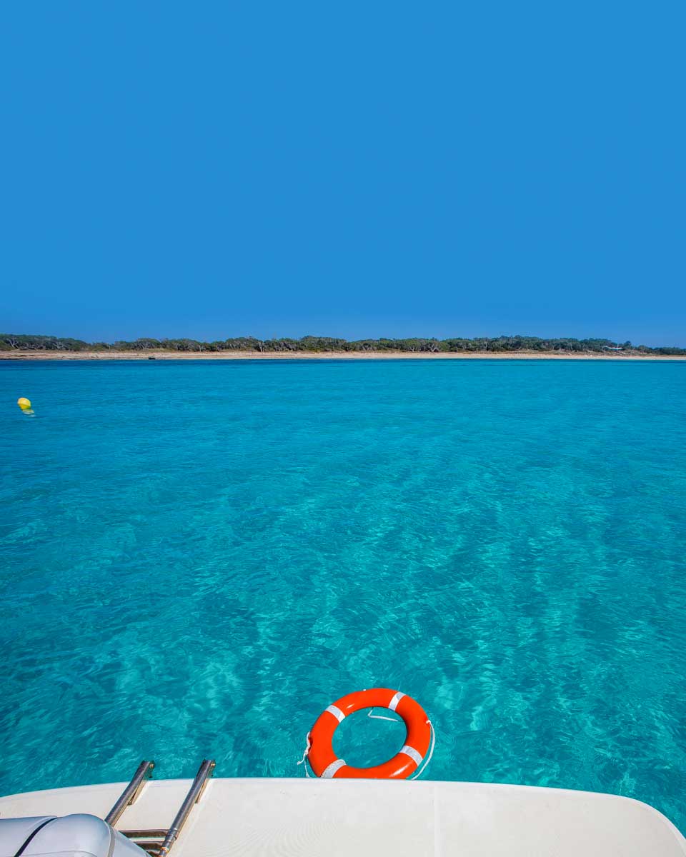 Formentera-Island-seen-from-sailboat-on-a-tour-from-Ibiza-Spain