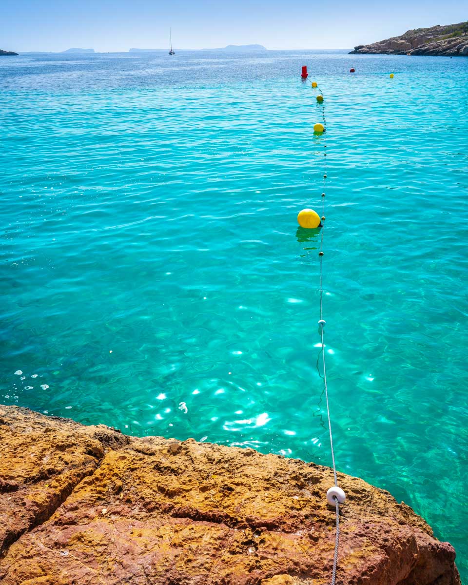 Looking at the water at Cala Saladeta in Ibiza Spain