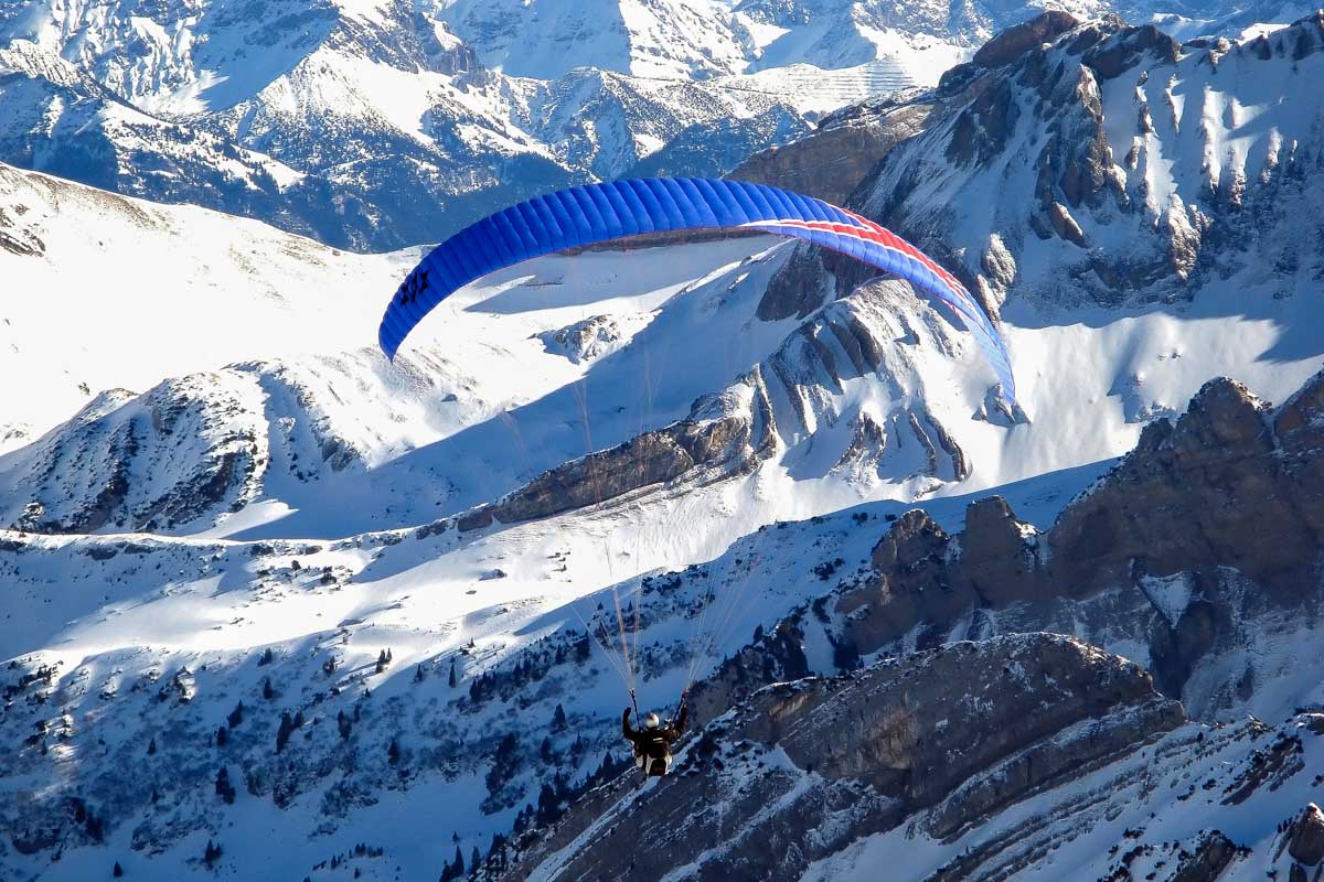 Paraglider above alps in Switzerland