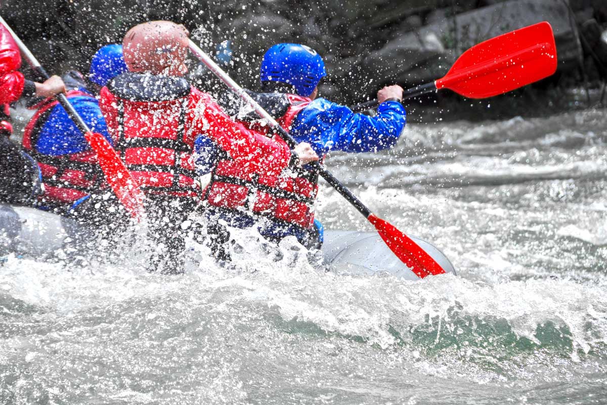 People white water raft in Switzerland