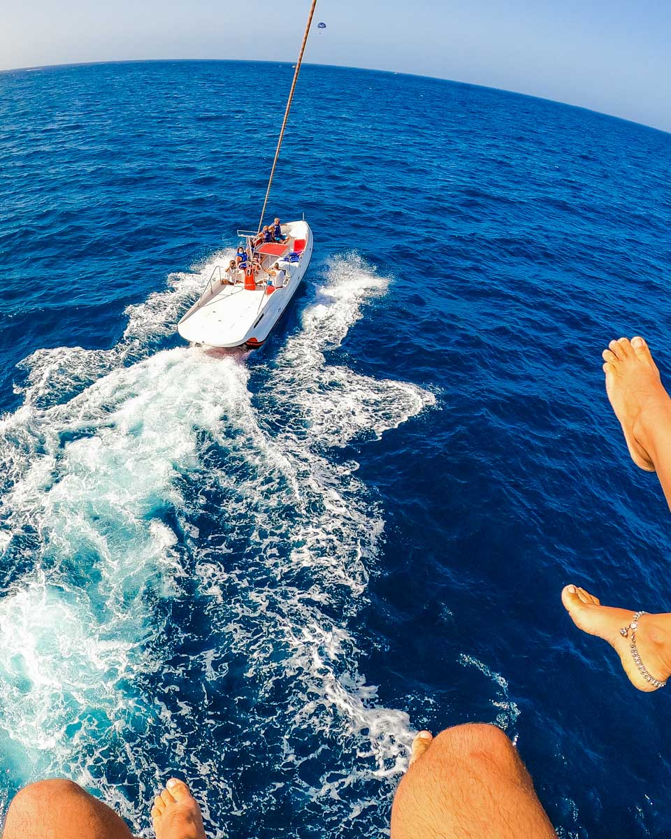 View-of-two-people-parasailing-over-the-ocean-in-Ibiza Spain