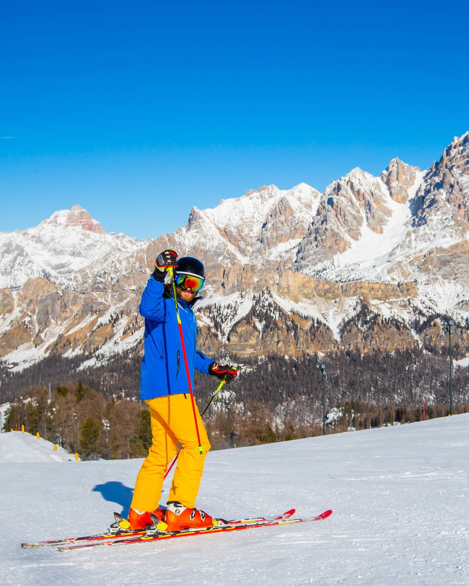 A man skis in Cortina d'Ampezzo winter Dolomites Italy
