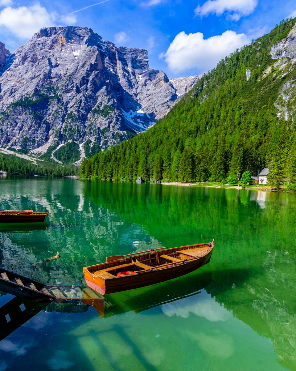 A wooden boat in Lago di Braies in the Dolomites Italy