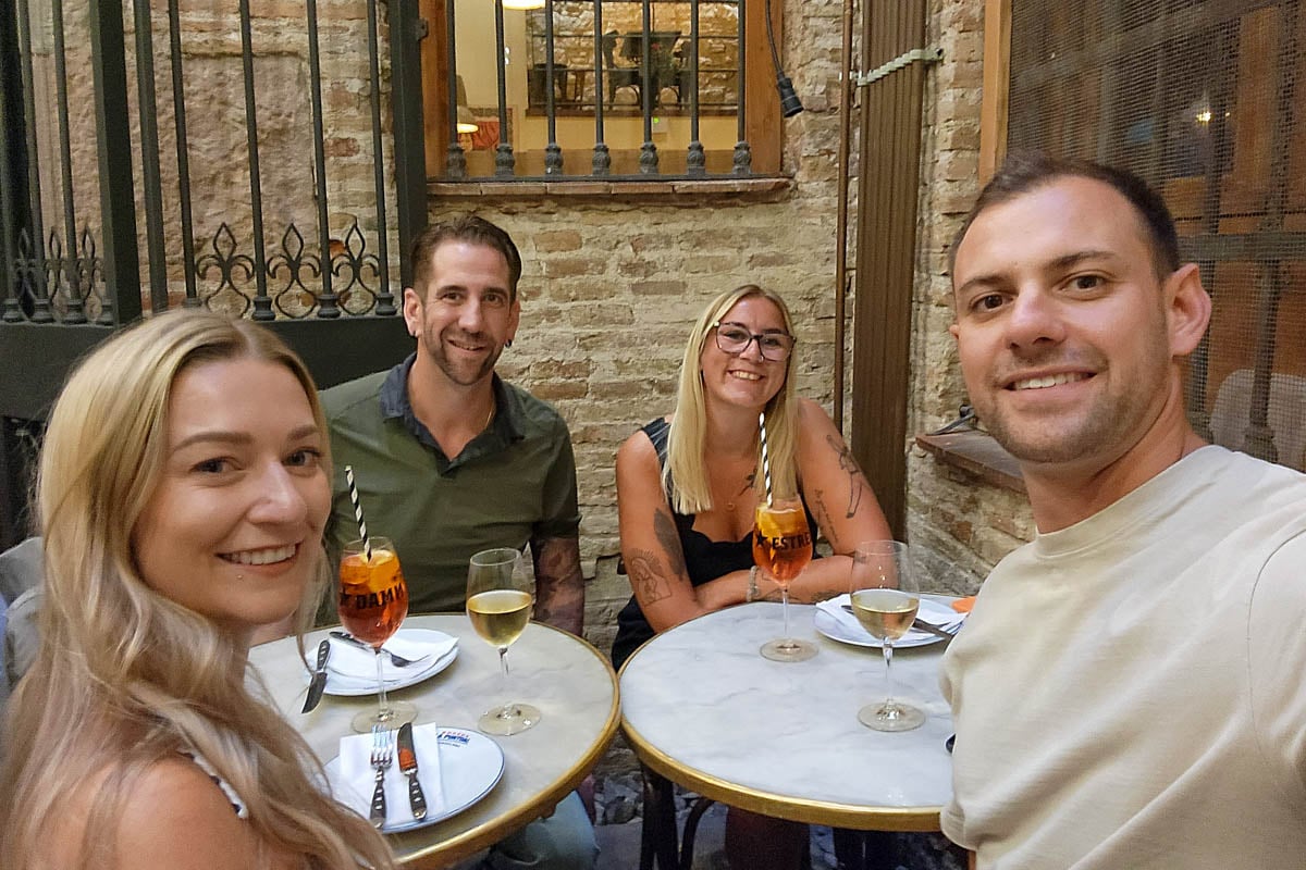Bailey and Daniel take a selfie with friends in Italy