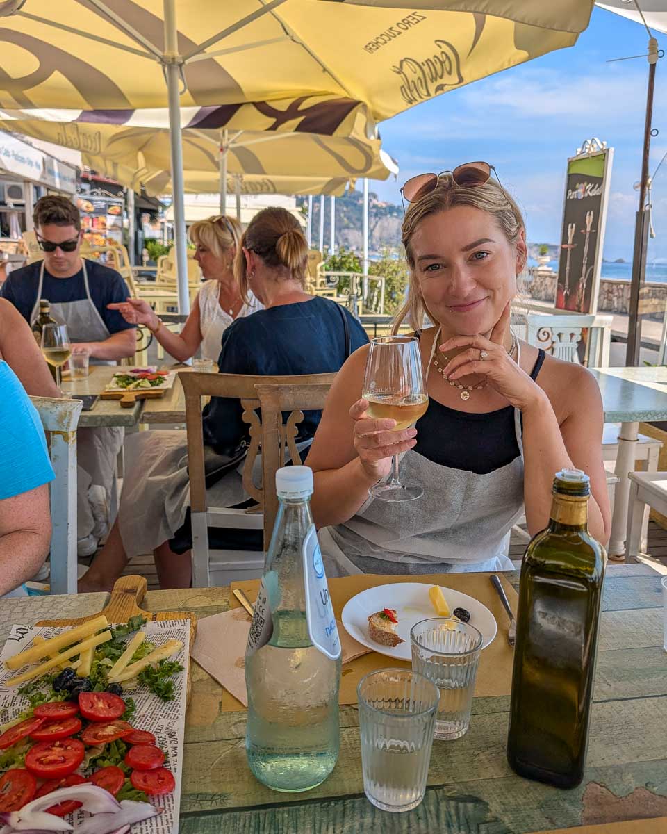 Bailey-drinks-wine-during-a-cooking-class-in-Taormina-Italy-1