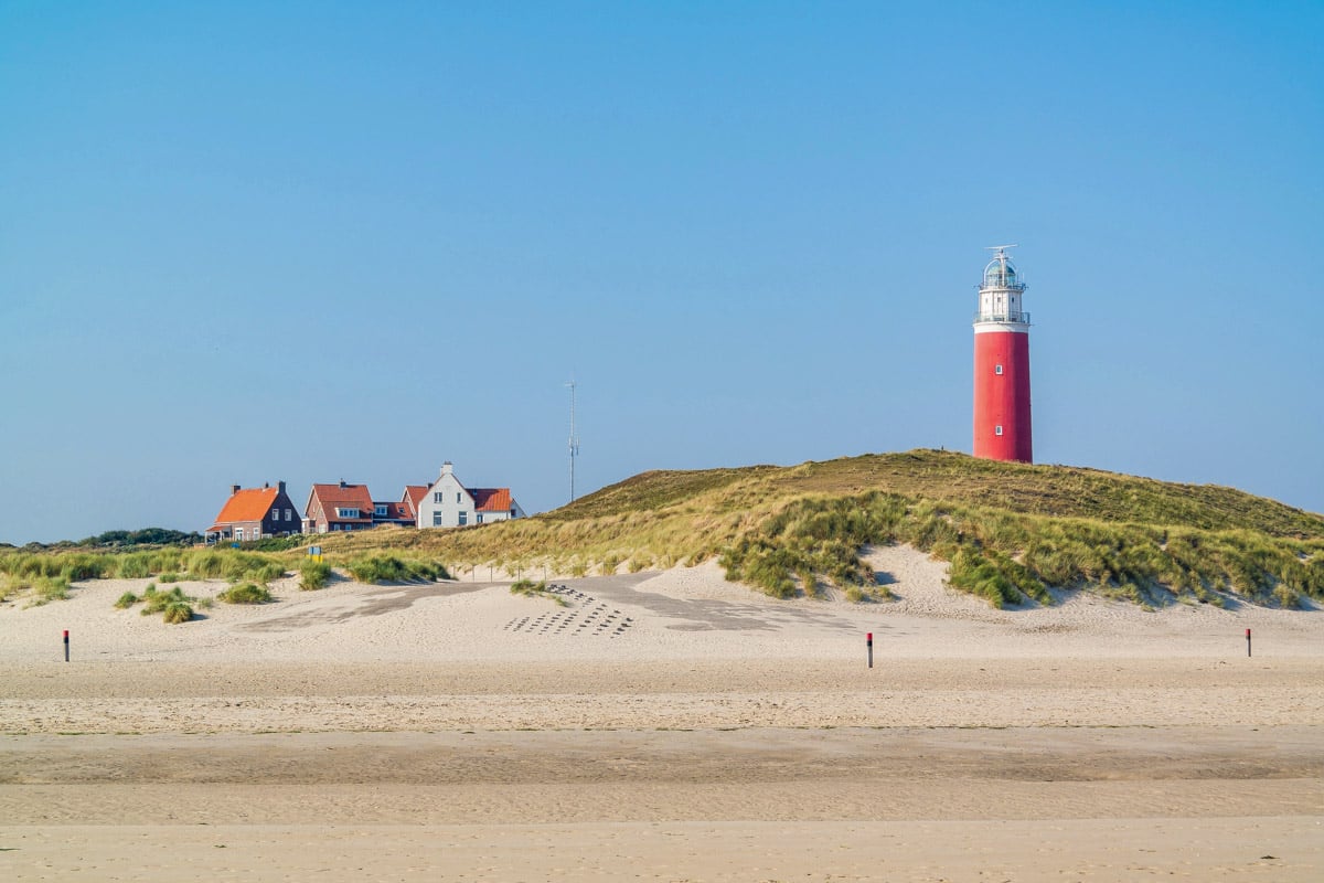 Beach and lighthouse De Cocksdorp, Texel, Netherlands