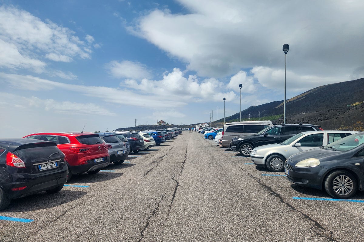 Cars parked at Mount Etna Italy with blue lines