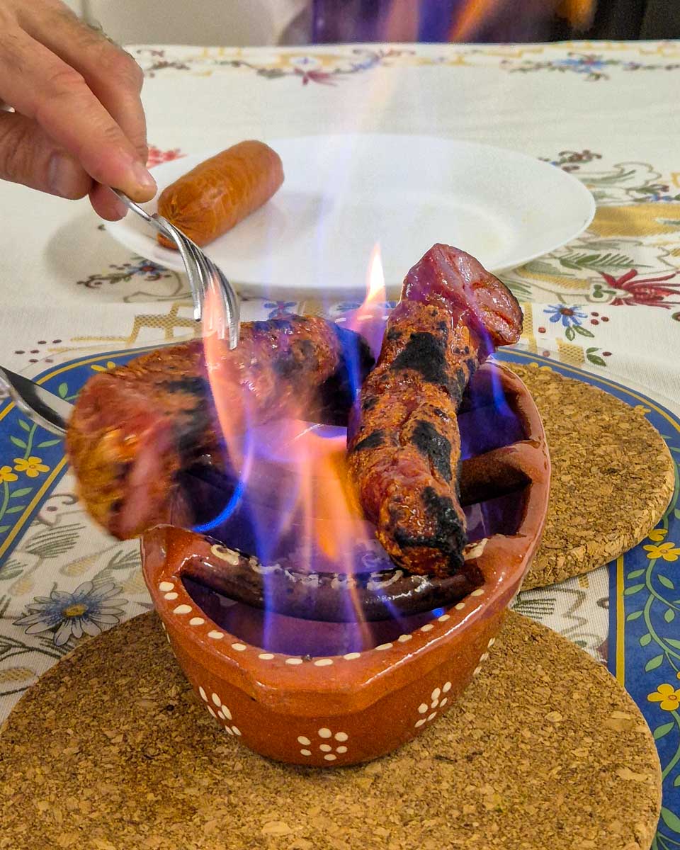 Chouriço à Bombeiro Portugese chorizo sausage eaten on a food tour in Sao Miguel Portugal