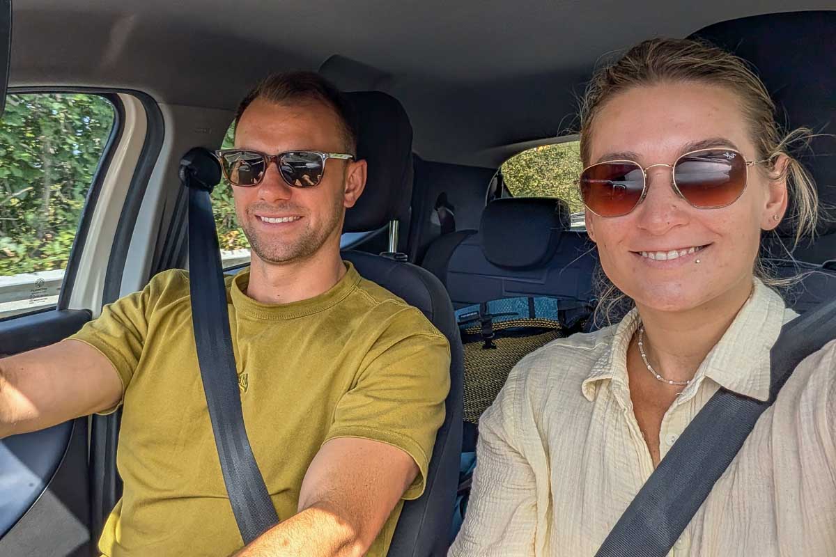 Daniel-and-Bailey-driving-a-rental-car-in-Italy on vacation