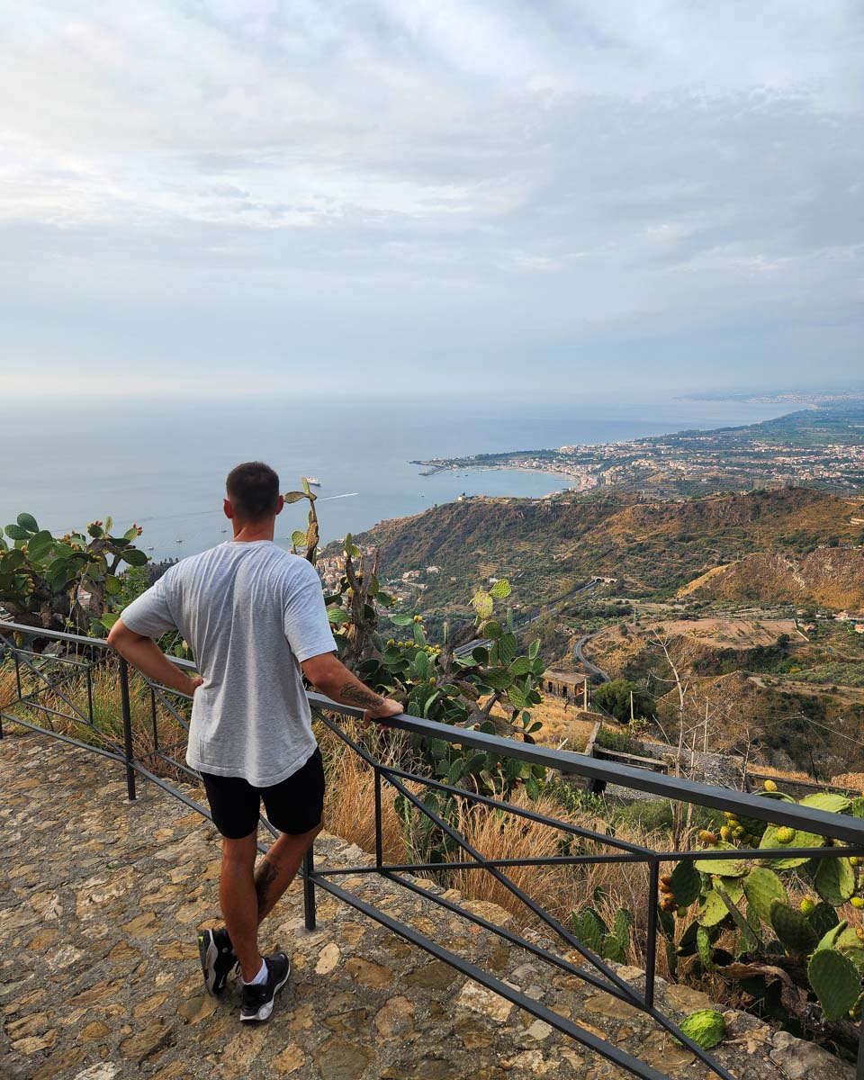Daniel at a scenic overlook in Taormina, Italy