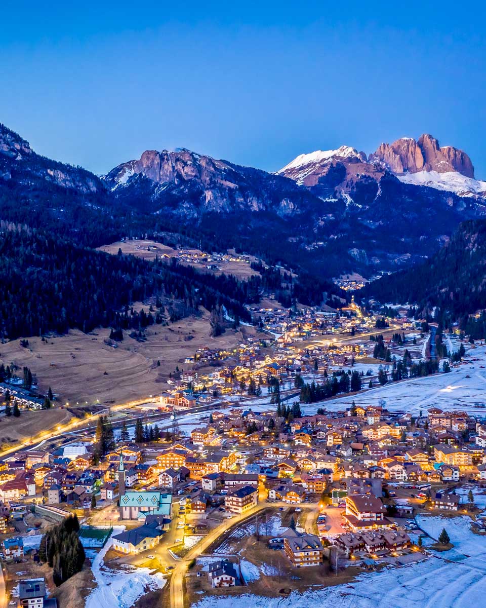 Night aerial view of Pozza di Fassa in the Dolomites Italy