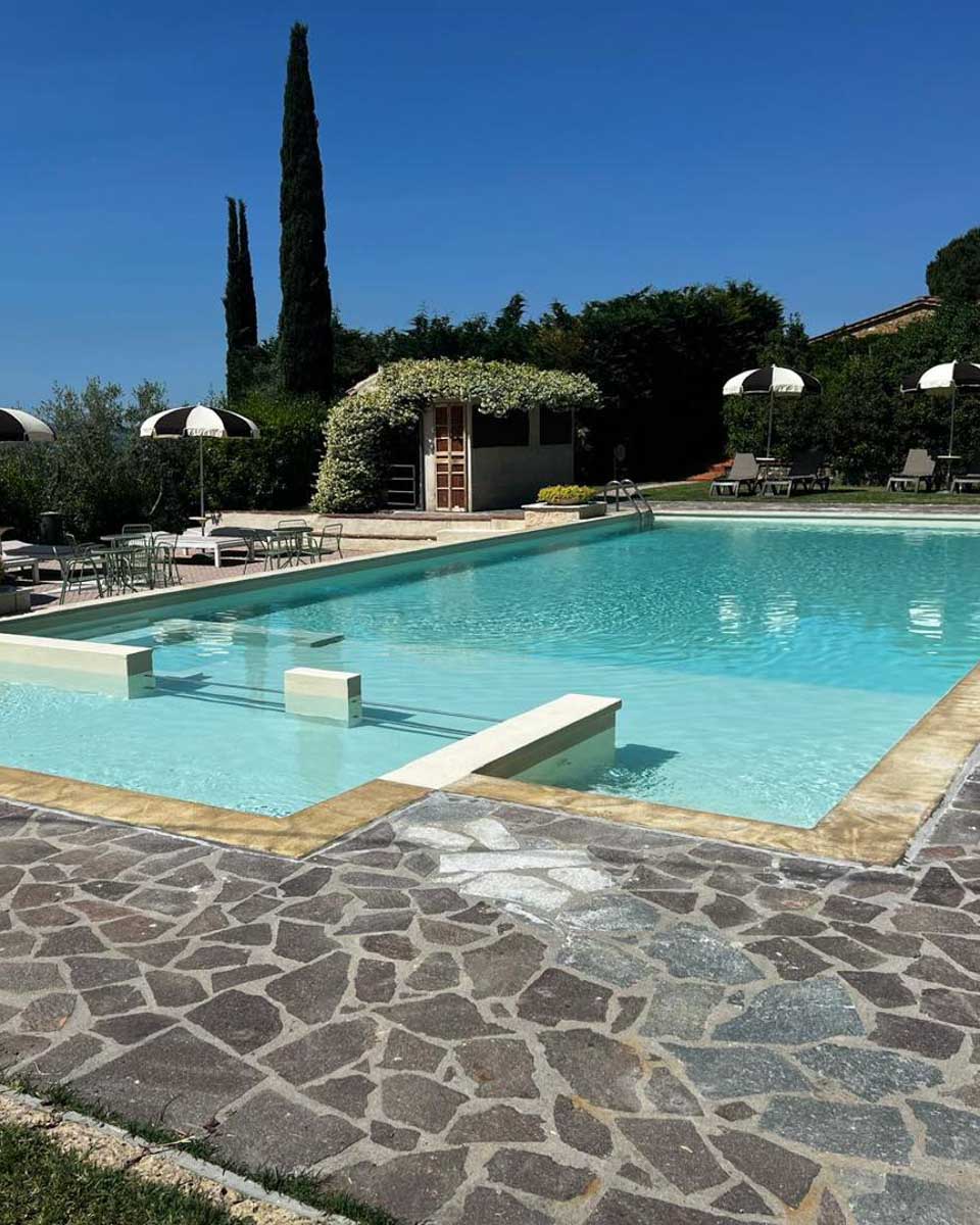 The outdoor pool area at Hotel Villa San Giorgio in Tuscany