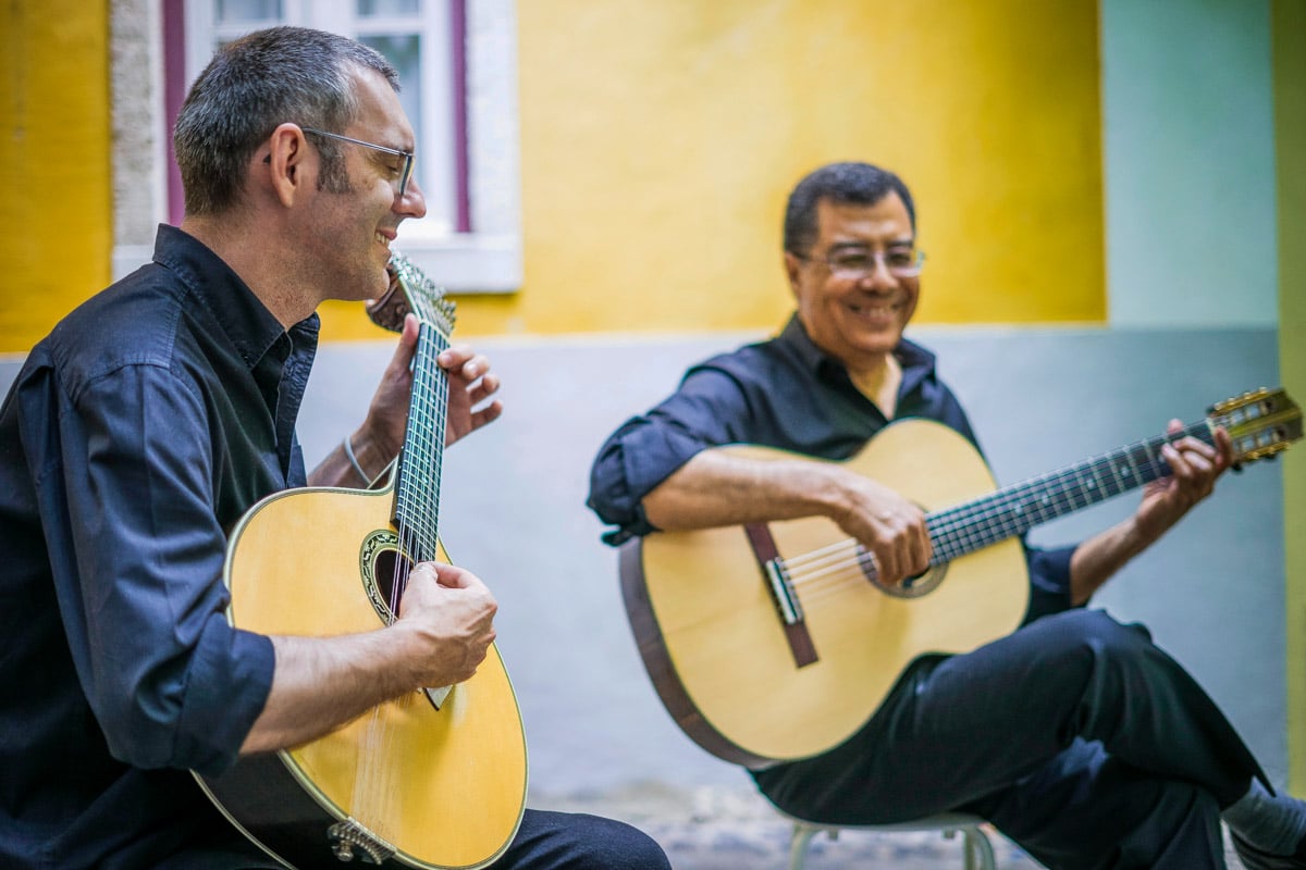 Two fado guitarists in Alfama district Lisbon Portugal