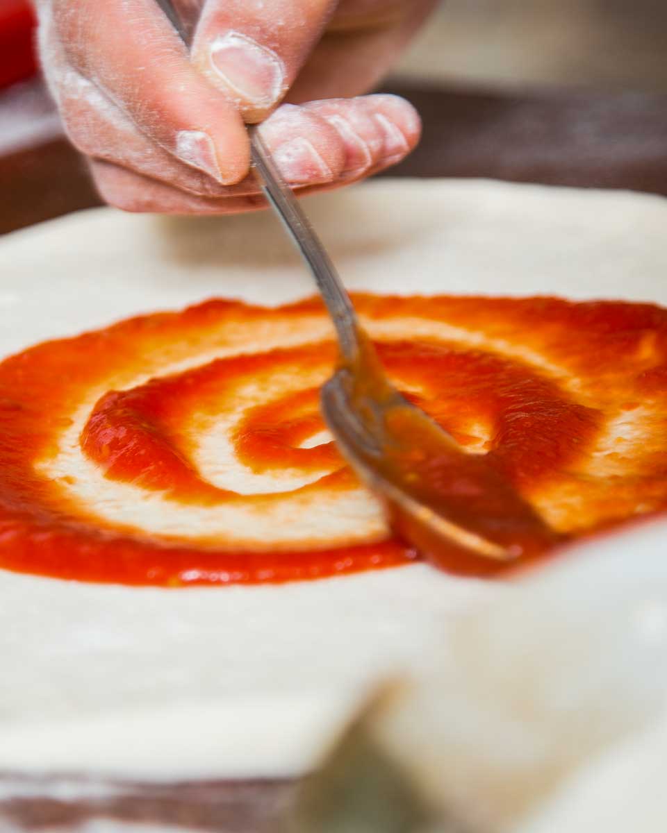 A-person-making-pizza-in-Palermo-Sicily-Italy