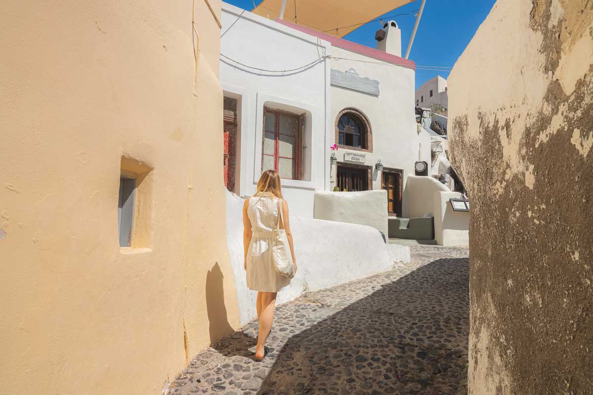 Bailey walks through a street in Greece