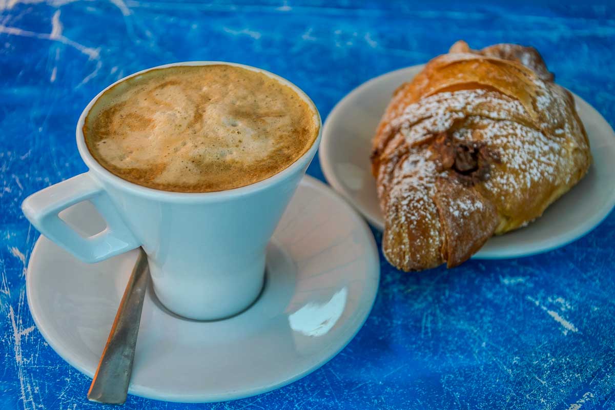 Cappuccino-with-croissant-for-breakfast-in-La Spezia Italy