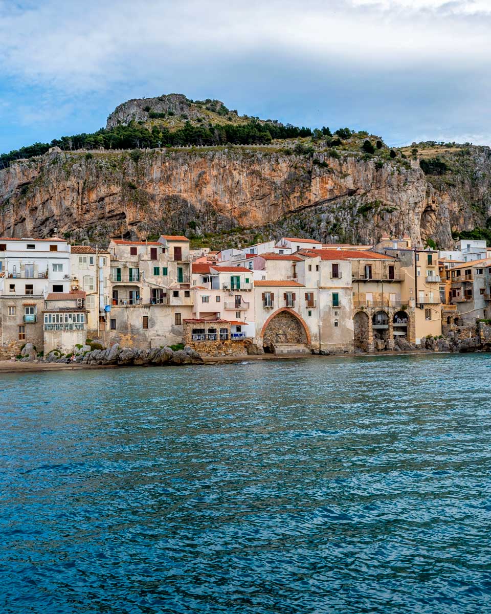 Cefalu Italy shoreline seen from a boat Sicily
