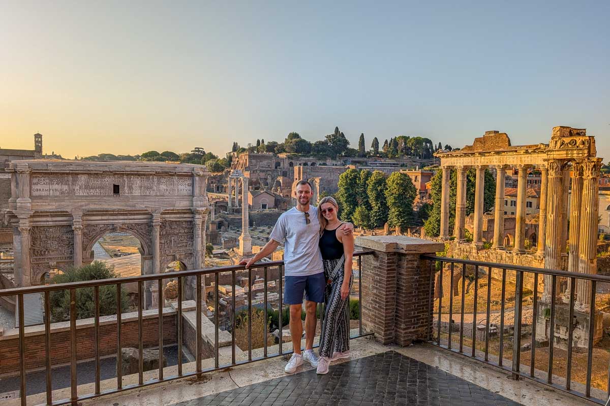 Daniel and Bailey smile at sunset in Rome Italy