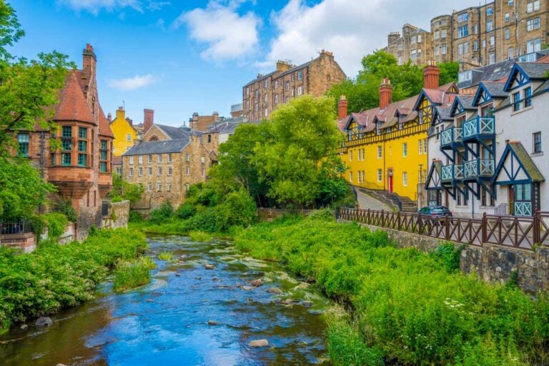Dean Village in Edinburgh Scotland with a river surrounded by old buildings