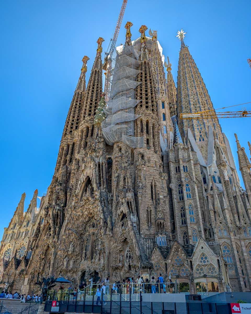 Looking up at Sagrada Familia on a sunny day in Barcelona Spain (1)