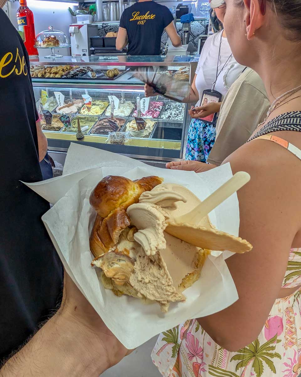 Someone-holding-a-treat-on-a-food-tour-in-Palermo-Italy