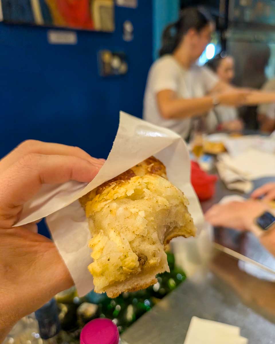 Someone-holding-food-on-a-food-tour-in-Palermo-Italy