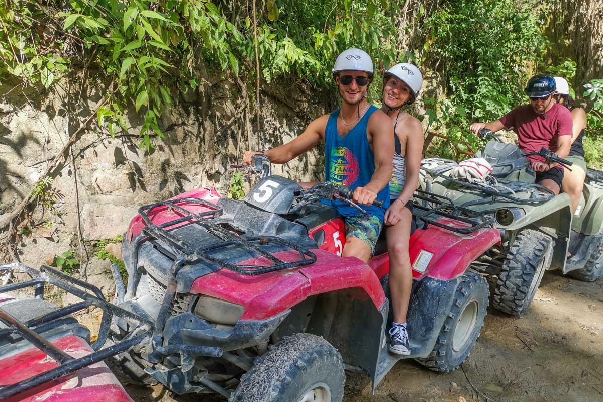 Two-people-sit-on-an-ATV-ready-to-start-the-tour-in-Sao Miguel Portugal