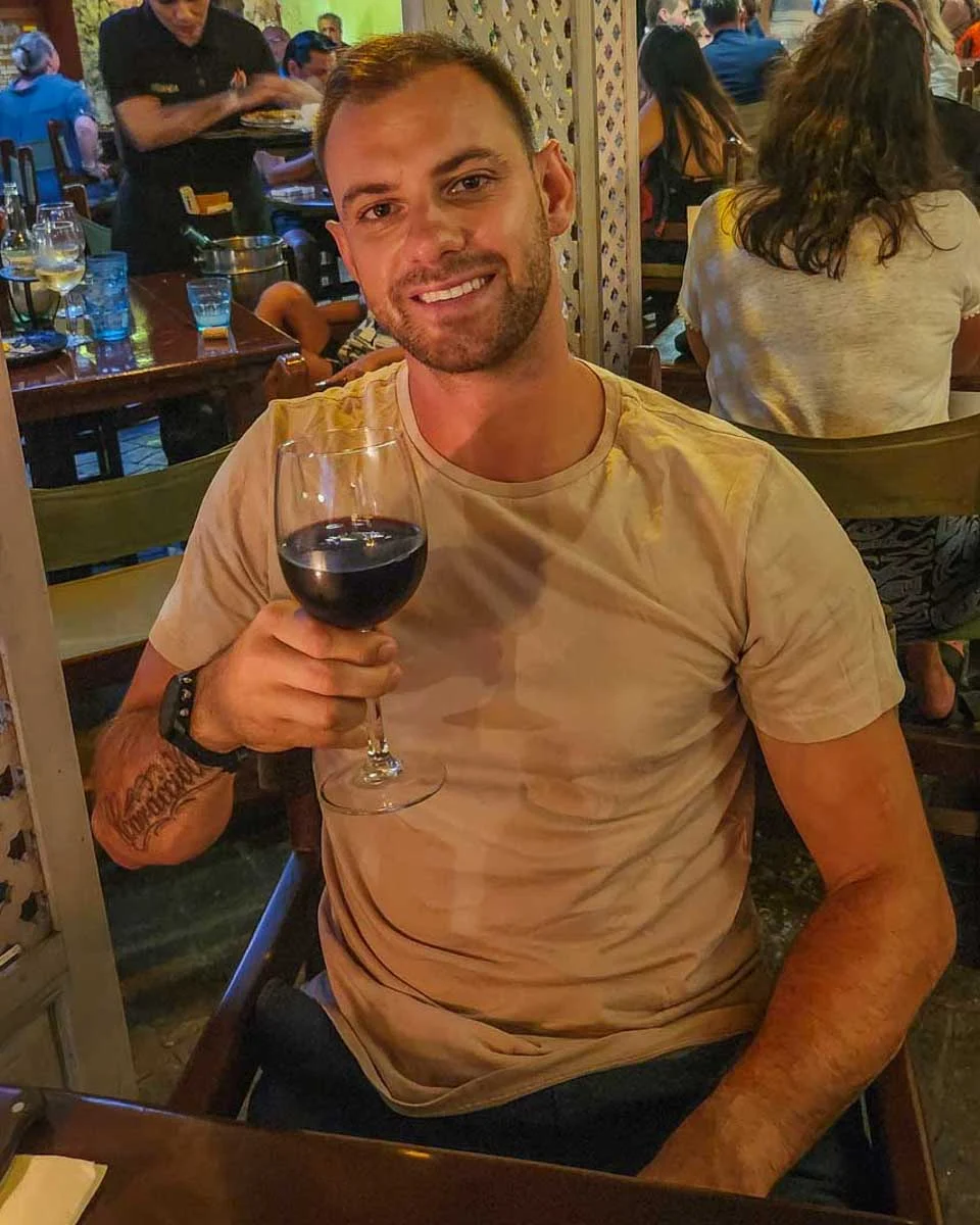 Daniel-enjoys-a-glass-of-wine-on-a-food-tour-in-Marbella Spain