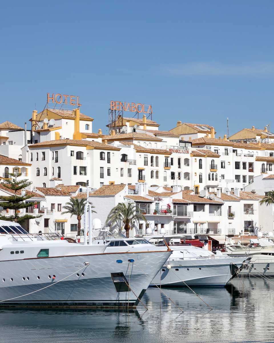 Looking at luxury yachts in the marina of Puerto Banus, Marbella, Spain