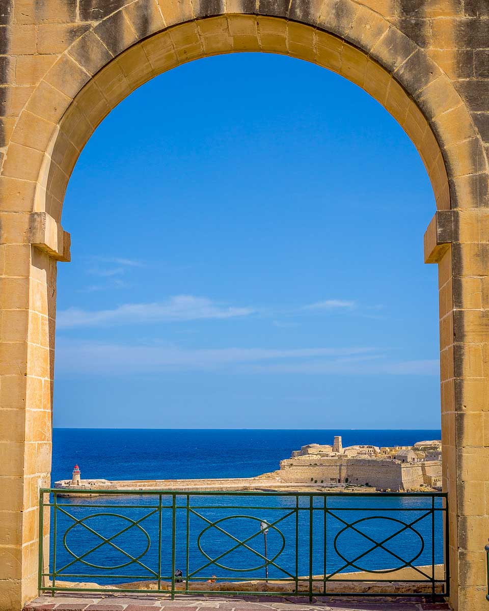 A-window-looking-out-into-the-Grand-Harbour-from-Arch-in-Upper-Barrakka-Gardens-of-Valletta-Malta-1