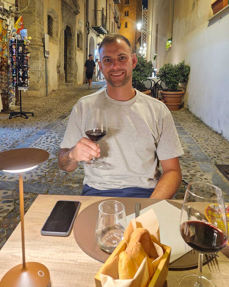 Daniel eats dinner with wine in Salerno Italy