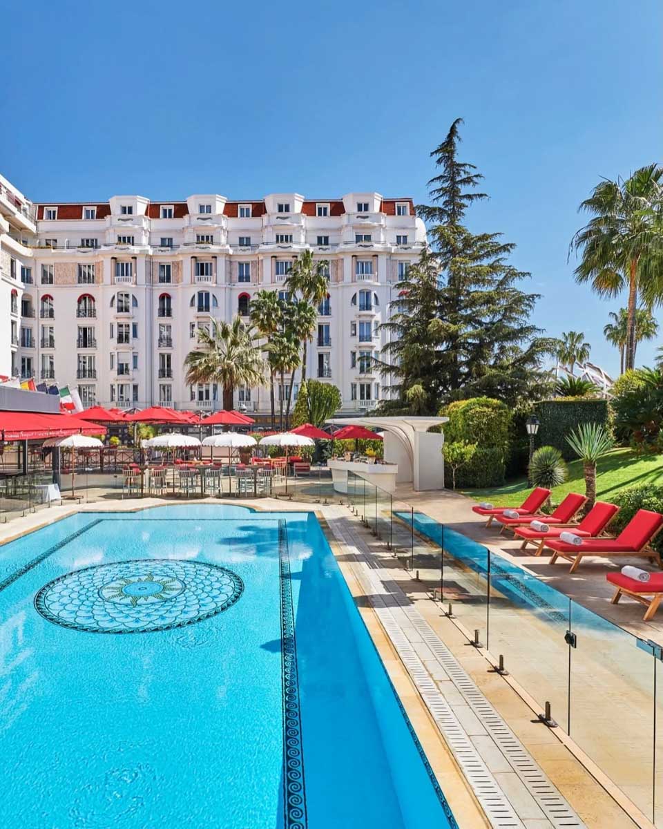 Th outdoor pool area at Hôtel Barrière Le Majestic Cannes